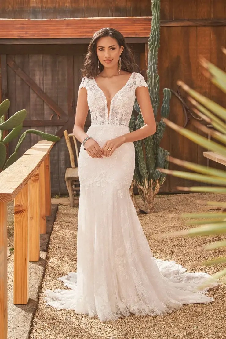 Model wearing a white gown by Lillian West. Desktop Image