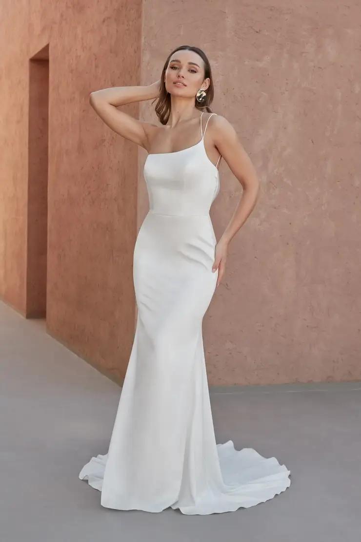 Model wearing a white gown by Adore. Desktop Image