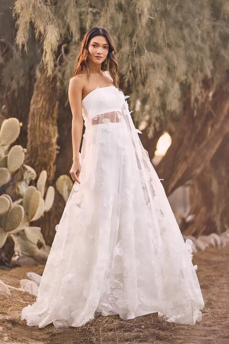 Model wearing a white gown by Lillian West. Desktop Image