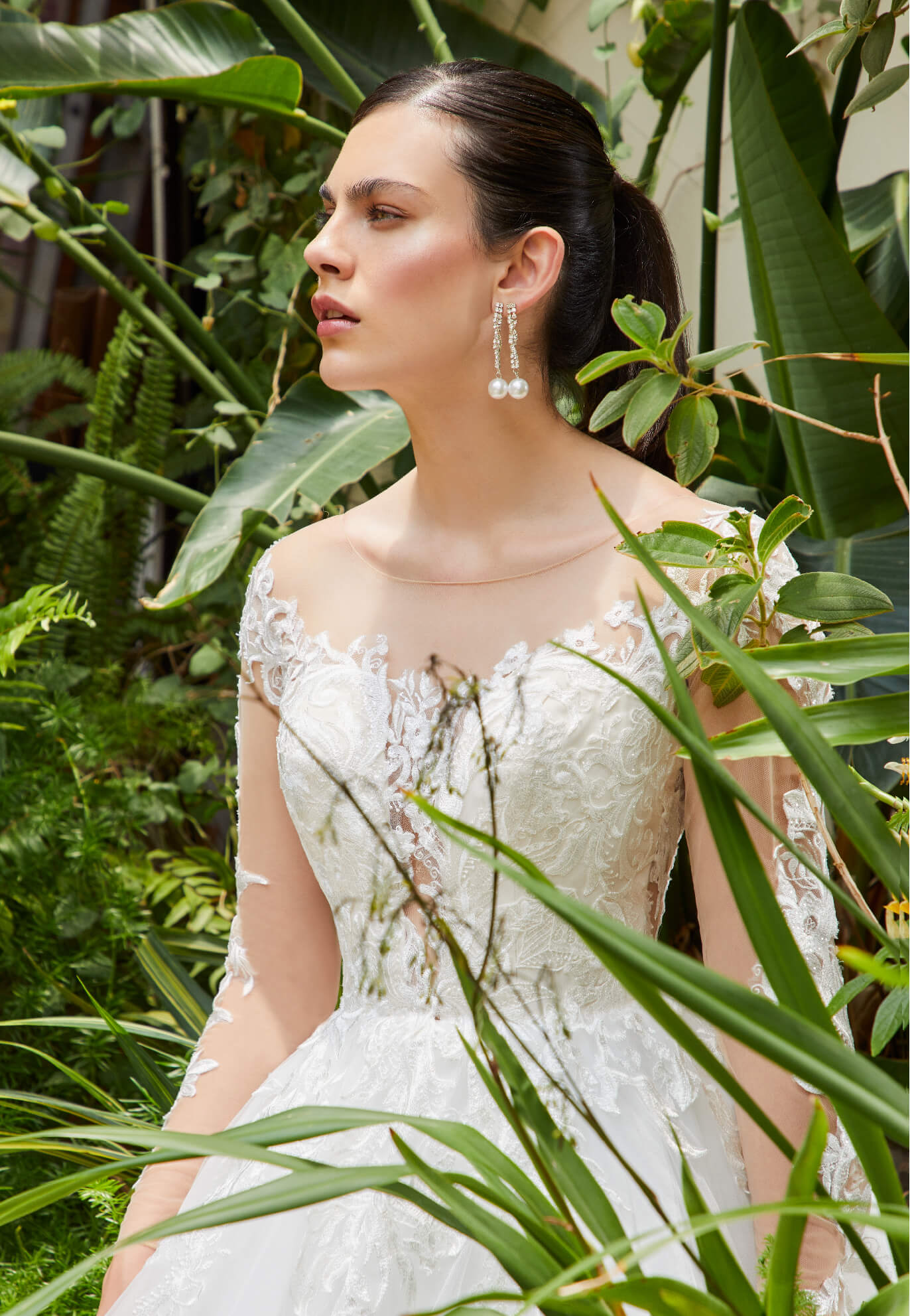 Model wearing a white gown by Lillian West. Desktop Image